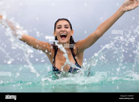 Woman Laughing on Boat Water Splashing