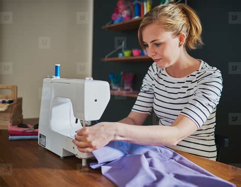 Woman Sewing on a Machine