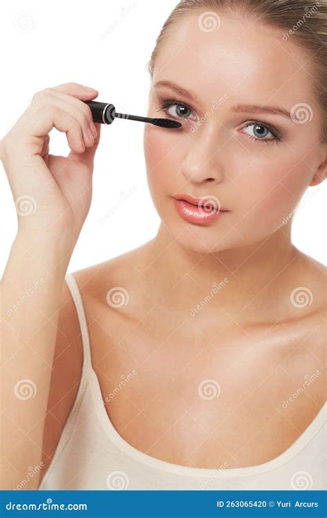Woman applying mascara