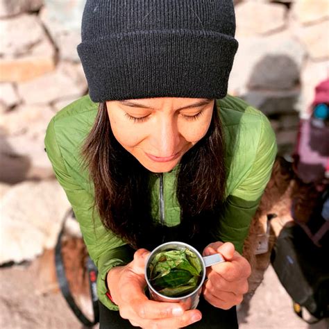 Woman drinking coca tea Cusco