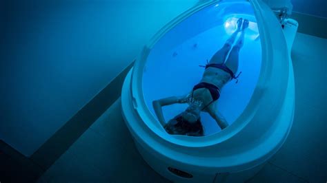Woman floating in floatation tank Philadelphia