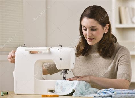 Woman using a sewing machine Houston TX