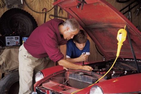 Image of a person working on a car in a storage unit
