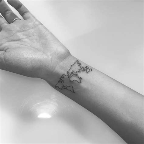 world map wrist tattoo Tattoos, Artsy tattoos, Trendy