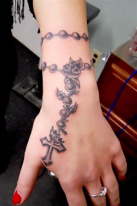 Minimalistic rosary tattoo around wrist 0 