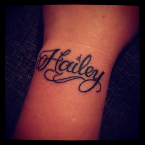 Daughters name tattoo on left wrist Name tattoos on