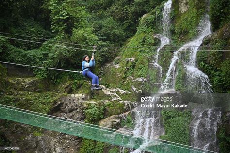 Ziplining over waterfall