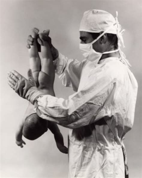 A Baby Slapping A Newborn Baby