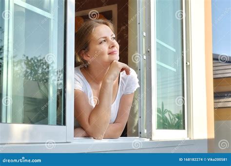 A person looking out a window