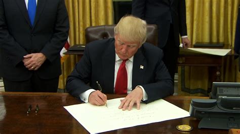 abc/president donald trump signs first executive order to begin obamacare repeal