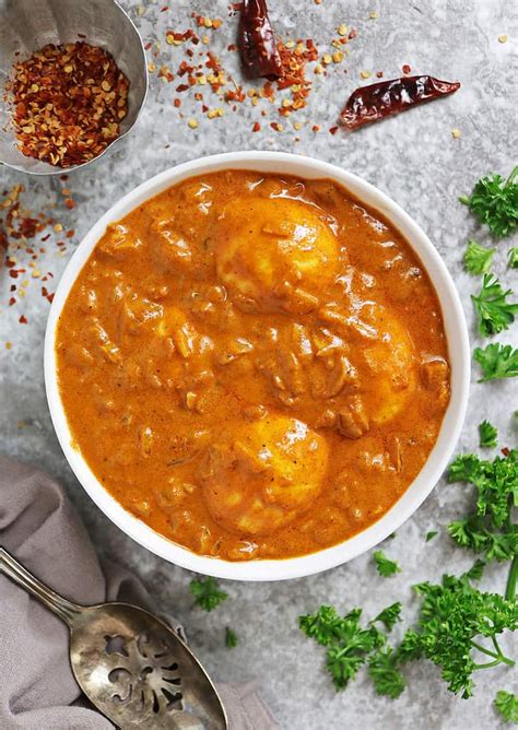 Adding boiled eggs to curry