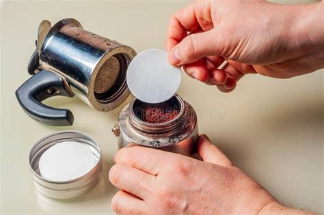 Adding Coffee Grounds To Filter