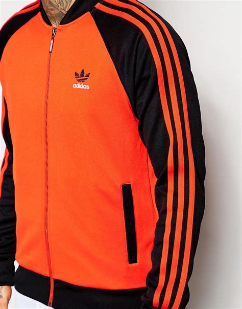 Adidas jacket black orange