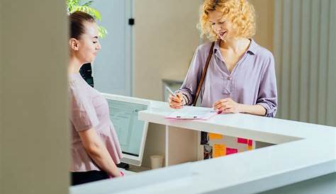 Female Receptionist with Smartphone Stock Photo Image of female