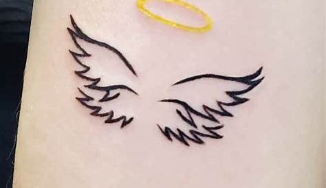 Minimalistic style angel wings and halo tattoo done in