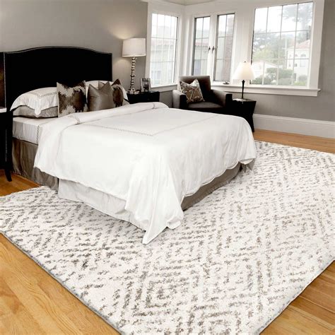 Shows the correct placement of a large area rug in the bedroom. I've