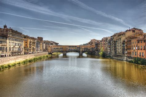 A scenic view of the Arno River flowing through Florence, showcasing its tranquility and charm