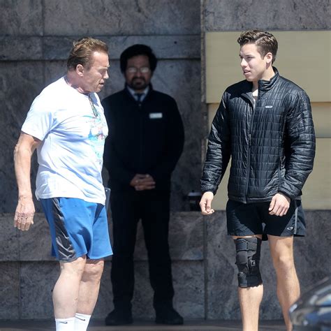 arnold schwarzenegger and his son in the gym