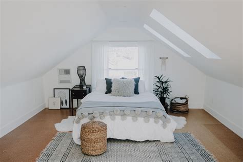 Attic bedroom with layered lighting