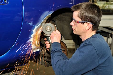 Auto Body Repair Shop Technician Using Tools