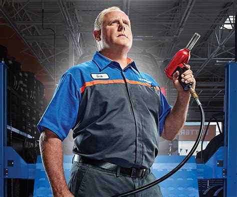 Mechanic performing express service on a Ford vehicle