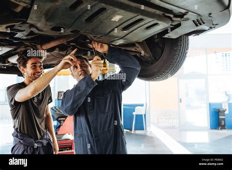 auto mechanic fixing car