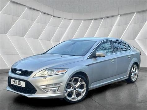 A sleek, modern automatic Ford Mondeo driving on a scenic road, showcasing its smooth performance and style.
