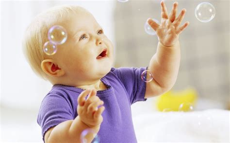 Baby playing with bubbles