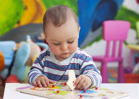 baby playing with puzzle