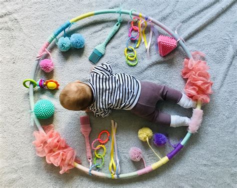 Baby playing with sensory toys