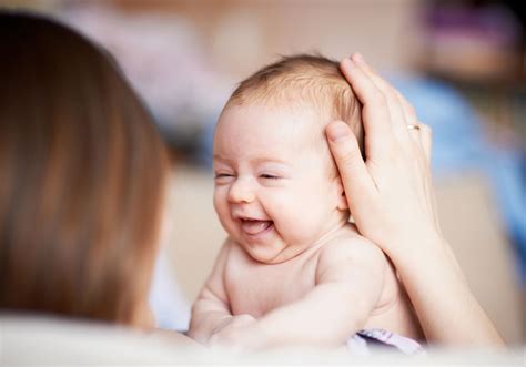 baby smiling at parent
