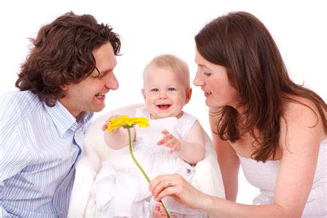 Baby smiling with family