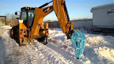 Backhoe With A Hammer