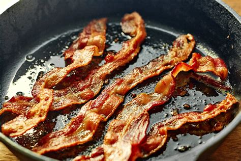 Image of crispy bacon strips in a frying pan