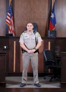 Bailiff assisting a judge with a document