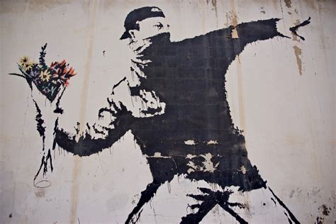 banksy art piece man throwing flowers