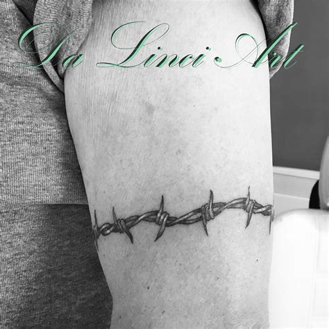 barbed wire tattoo female