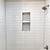 bathroom white brick tiles with grey grout