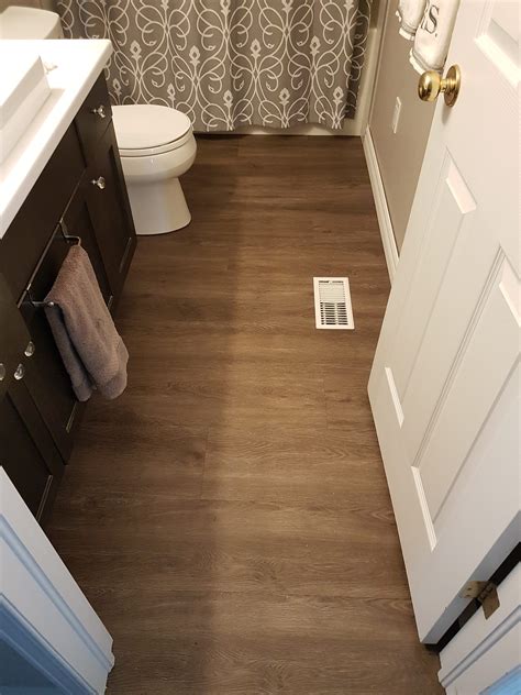 White Vinyl Plank Flooring Bathroom TRENDECORS