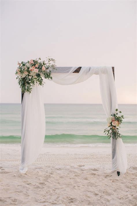 greenery beach wedding arch Beach wedding arch, Beach wedding flowers