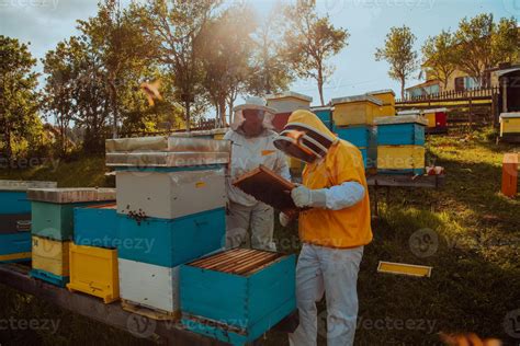 Beekeepers with beehives