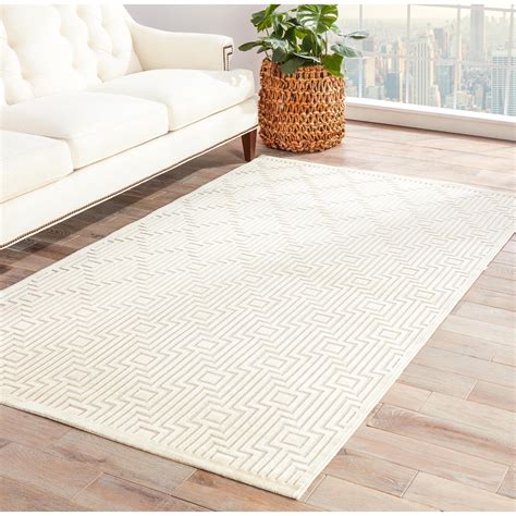 beige white geometric rug