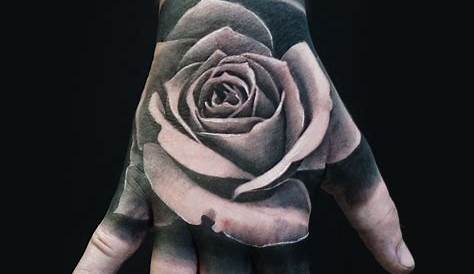 Black and grey rose hand tattoo by Jesse Vardaro at Fable