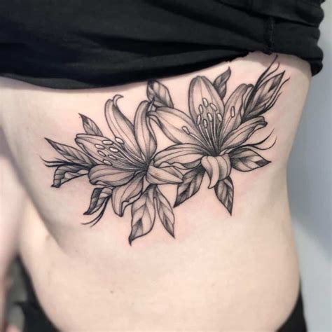 Black Floral Hip Tattoo Lily tattoo design, Lily tattoo, Tiger lily tattoos