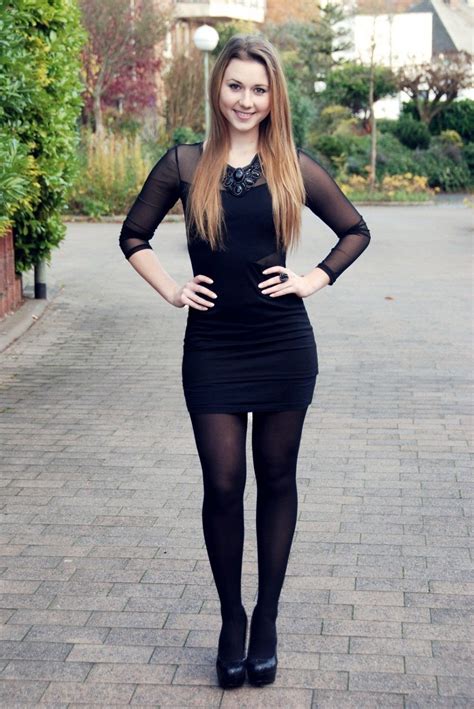 Black dress with long back black stockings and patent leather heels