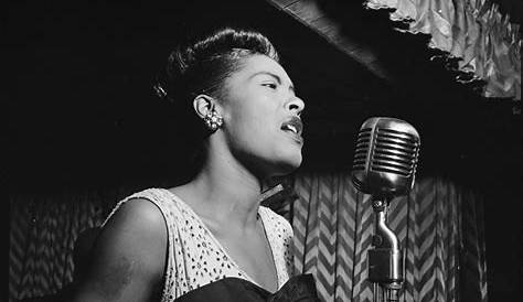 Female African-American rhythm and blues musician singing on stage