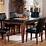 Black granite dining table top looks good in a modern dining room