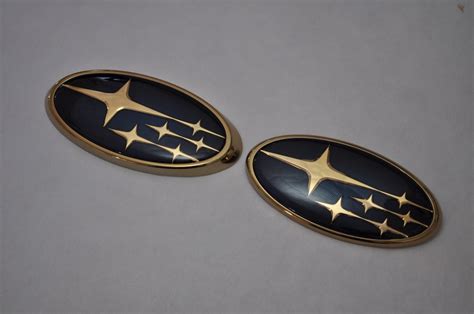 black and gold subaru emblem