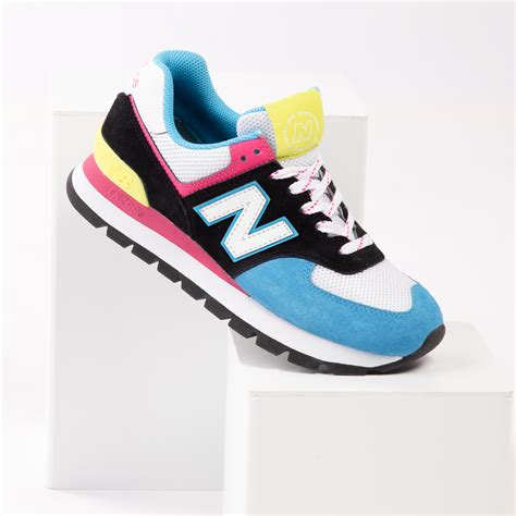 black and pink new balance sneakers