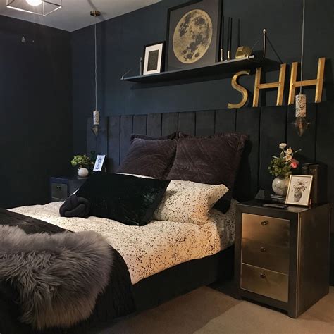 Black Bed Frame in Dark Blue Bedroom